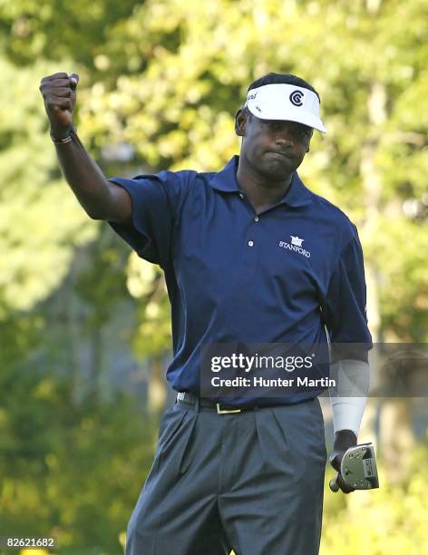 Vijay Singh of Fiji Islands celebrates his birdie putt on the 17th hole during the final round of the Deutsche Bank Championship at TPC Boston on...