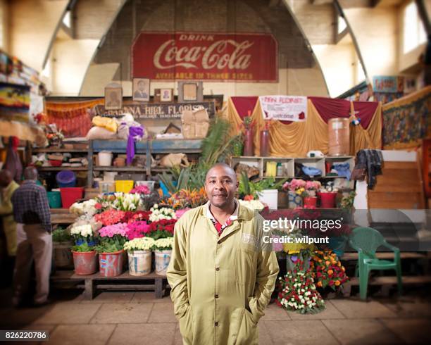male flower seller - kenya business stock pictures, royalty-free photos & images