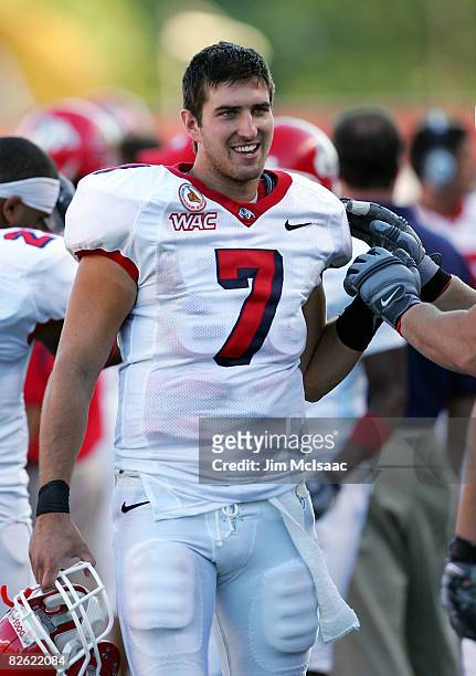 Tom Brandstater of the Fresno State Bulldogs celebrates on the sidelines against the Rutgers Scarlet Knights at Rutgers Stadium on September 1, 2008...