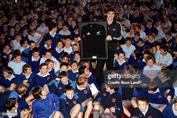 Conrad Smith of the All Blacks presents his second test jersey to the pupils of Francis Douglas Memorial College prior to the New Zealand All Blacks...