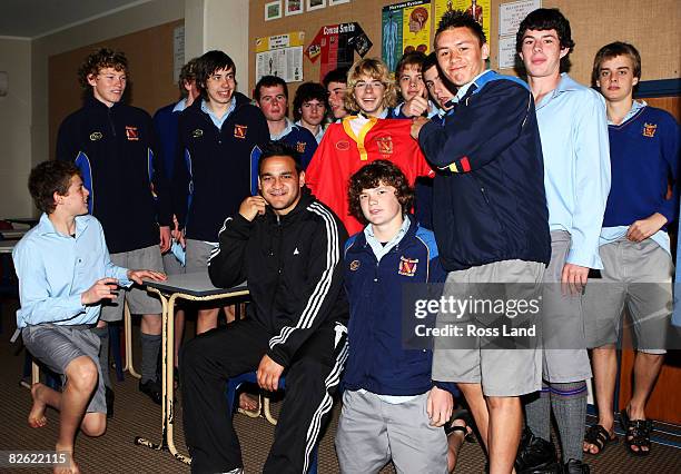 Piri Weepu of the All Blacks poses for a photograph with students during a community visit to Francis Douglas Memorial College prior to the New...
