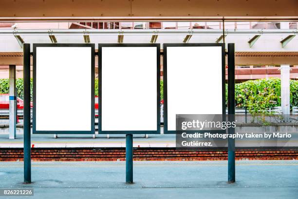 blank billboards at train station - billboard photos et images de collection