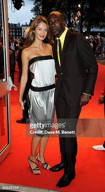 Ozwald Boateng and wife Gyunel arrive at the world film premiere of 'RocknRolla', at Odeon West End on September 1, 2008 in London, England.