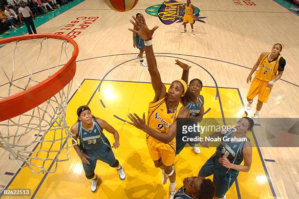 Lisa Leslie of the Los Angeles Sparks puts a shot against the defense of the Minnesota Lynx during their game at Staples Center on September 1, 2008...