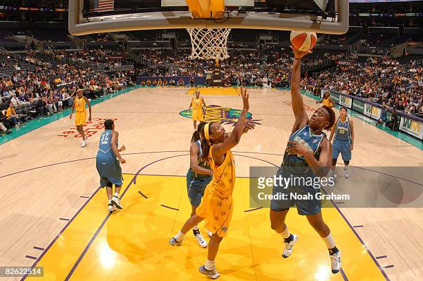 Charde Houston of the Minnesota Lynx goes to the basket against Jessica Moore of the Los Angeles Sparks at Staples Center on September 1, 2008 in Los...