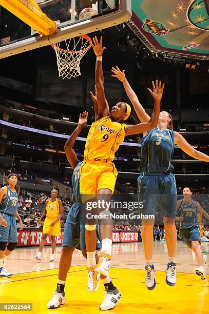 Lisa Leslie of the Los Angeles Sparks puts up a shot against Nicole Ohlde of the Minnesota Lynx at Staples Center on September 1, 2008 in Los...