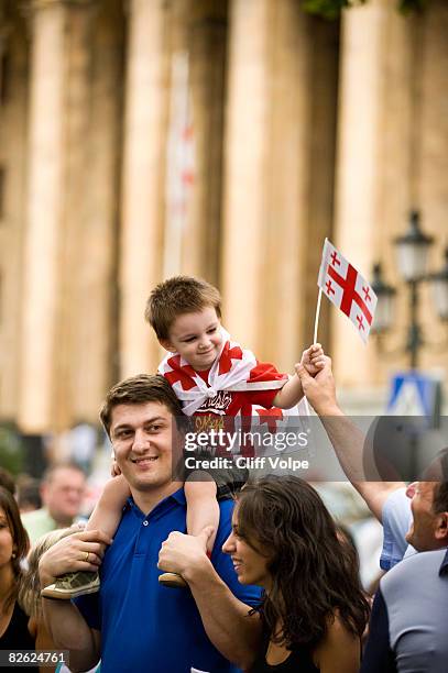 Young boy waves a Georgian flag during a peace rally on September 1, 2008 in Tbilisi, Georgia. Rallies were held simultaneously across Georgia with...