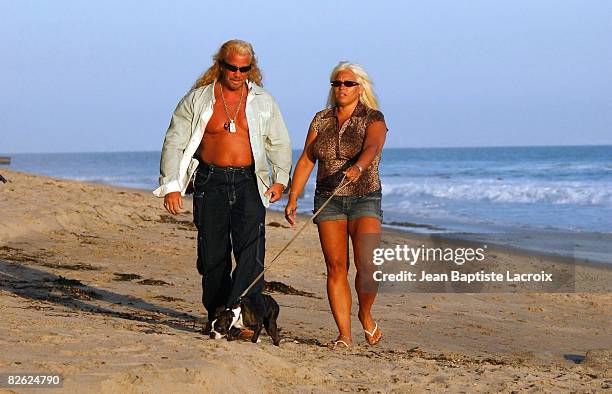 Personalities Duane 'Dog' Chapman and Beth Smith walk on September 1, 2008 in Malibu, California.