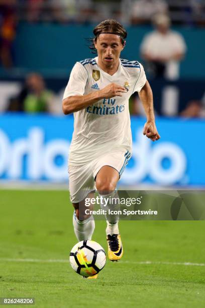 Real Madrid midfielder Luka Modric in action during the first half of the International Champions Cup match against Barcelona at Hard Rock Stadium in...