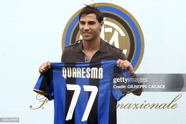 Portugal winger Ricardo Quaresma poses with his new jersey after signing for Inter Milan in Appiano Gentile, north-west of Milan, on September 2,...