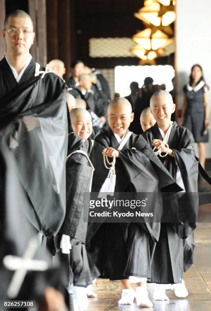 Children have become Buddhist "priests" following a special ceremony at Higashi Honganji, a temple in Kyoto, on Aug. 4, 2017. Around 100 children,...