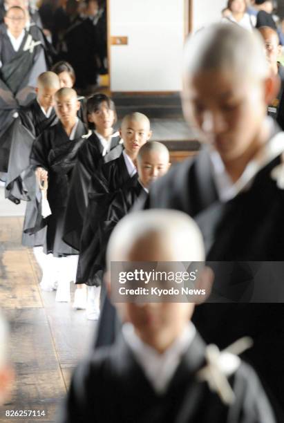 Children have become Buddhist "priests" following a special ceremony at Higashi Honganji, a temple in Kyoto, on Aug. 4, 2017. Around 100 children,...