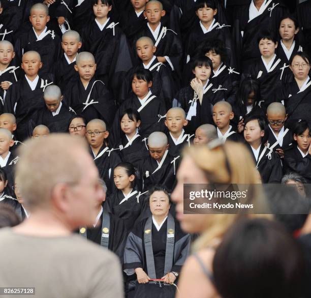 Children have become Buddhist "priests" following a special ceremony at Higashi Honganji, a temple in Kyoto, on Aug. 4, 2017. Around 100 children,...