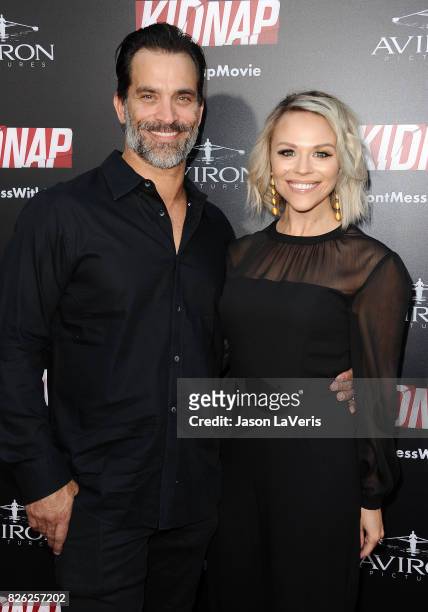 Actor Johnathon Schaech and wife Julie Solomon attend the premiere of "Kidnap" at ArcLight Hollywood on July 31, 2017 in Hollywood, California.