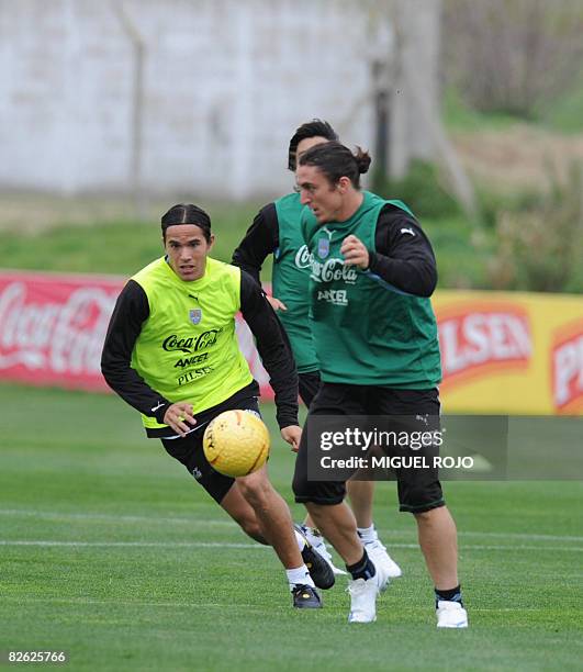 Uruguayan footballers Alvaro Gonzalez and Cristian Rodriguez vie for the ball during a training session on September 2, 2008 in Montevideo. Uruguay...