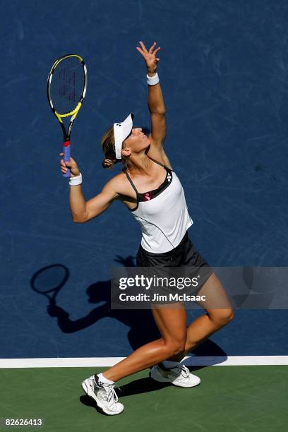 Elena Dementieva of Russia serves against Patty Schnyder of Switzerland during Day 9 of the 2008 U.S. Open at the USTA Billie Jean King National...