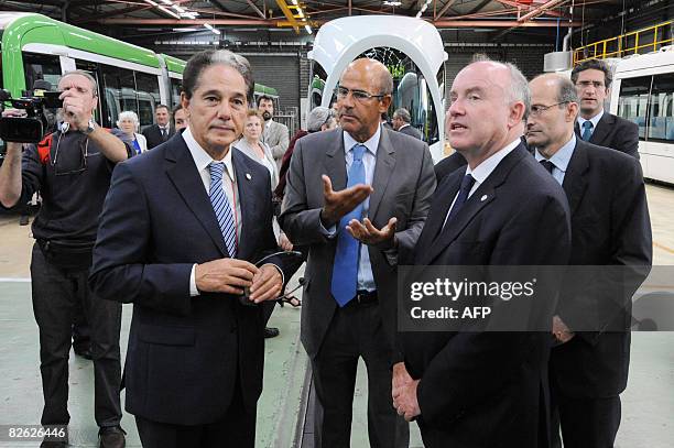Chief executive officer of French engineering Alstom, Patrick Kron talks with Tunisia's Transport Minister Abderrahim Zouari and France's Transport...