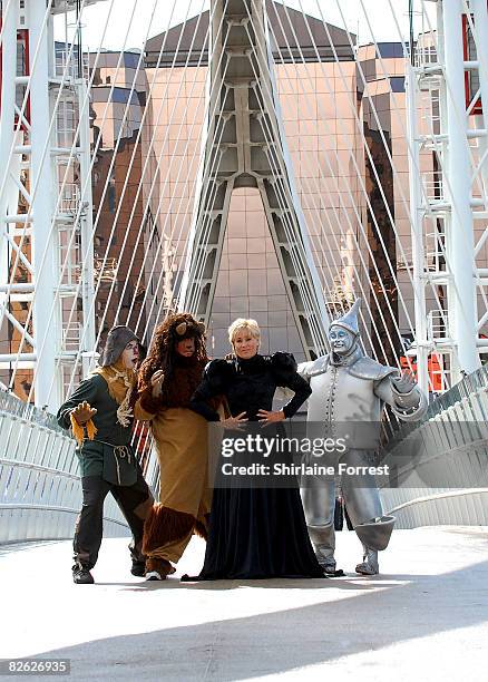 Lorna Luft in character as the Wicked Witch poses in costume with Scarecrow Ian Casey, Lion Jamie Greer and Tin Man Joe Standerline during a...