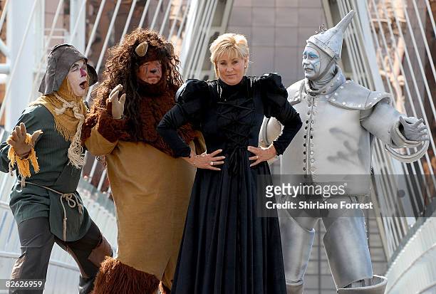 Lorna Luft in character as the Wicked Witch poses in costume with Scarecrow Ian Casey, Lion Jamie Greer and Tin Man Joe Standerline during a...