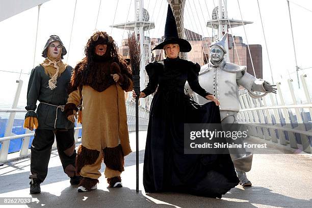 Lorna Luft in character as the Wicked Witch poses in costume with Scarecrow Ian Casey, Lion Jamie Greer and Tin Man Joe Standerline during a...