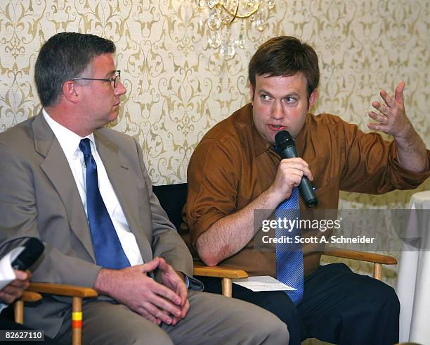 Cyrus Krohn, left, listens as Frank Luntz makes a point September 1, 2008 at the Nicollet Island Inn in Minneapolis, Minnesota.