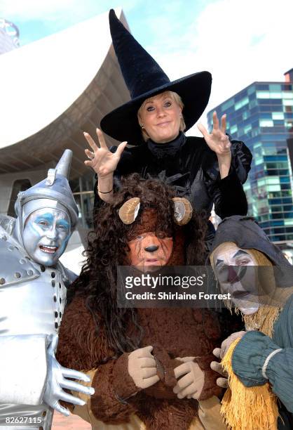 Lorna Luft in character as the Wicked Witch poses in costume with Tin Man Joe Standerline, Lion Jamie Greer and Scarecrow Ian Casey during a...