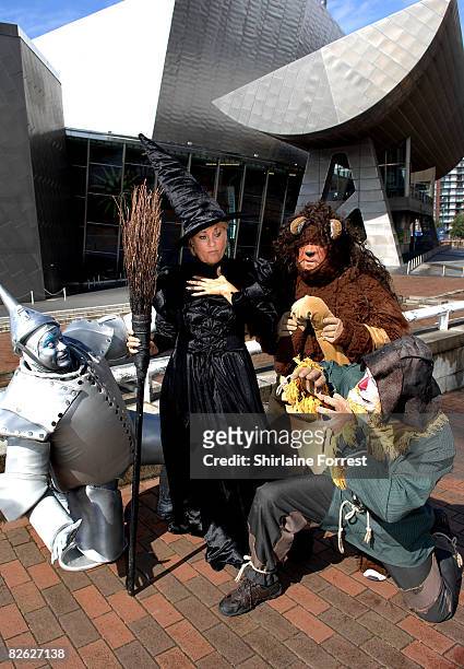Lorna Luft in character as the Wicked Witch poses in costume with Tin Man Joe Standerline , Lion Jamie Greer and Scarecrow Ian Casey during a...