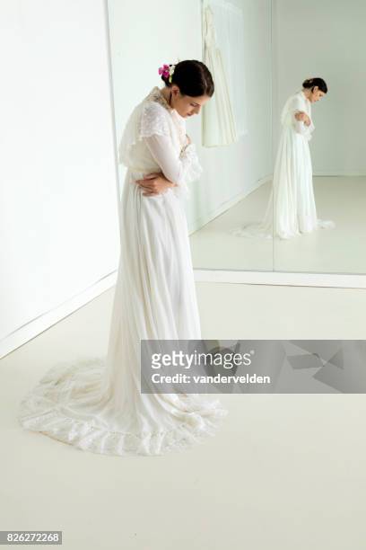 bride in the dress shop - woman full length mirror stock pictures, royalty-free photos & images