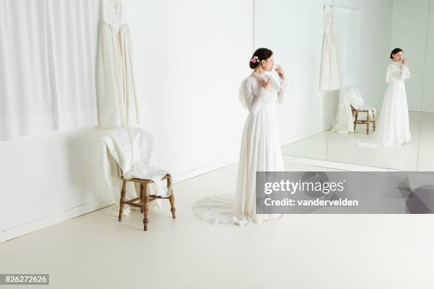 bride in the dress shop - woman full length mirror stock pictures, royalty-free photos & images