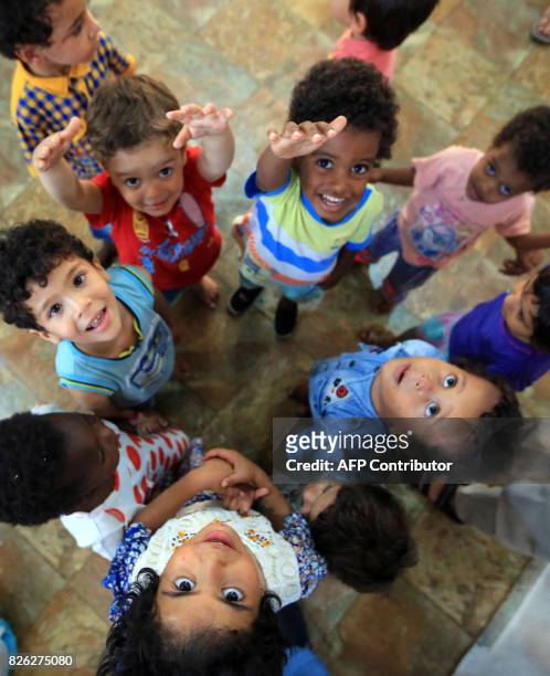 Picture taken on August 2, 2017 shows children of Islamic State group fighters currently living in the Libyan Red Crescent headquarters in Misrata, a...