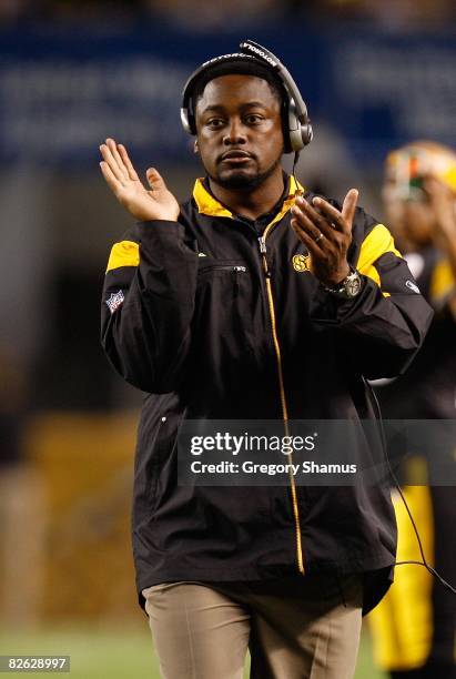 Head Coach Mike Tomlin of the Pittsburgh Steelers applauds his team during a preseason NFL game against the Carolina Panthers on August 28, 2008 at...