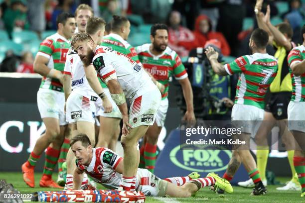 Josh McCrone and Jack de Belin of the Dragons looks dejected after Bryson Goodwin of the Rabbitohs scored a try late in the match to level the scores...