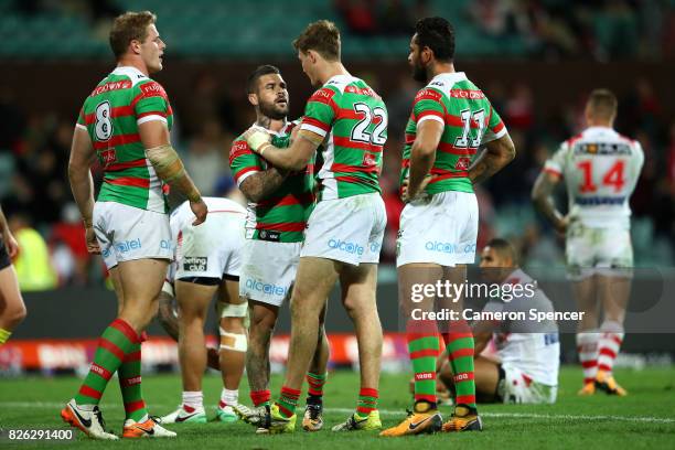 Adam Reynolds of the Rabbitohs embraces team mate Campbell Graham of the Rabbitohs after winning the round 22 NRL match between the St George...