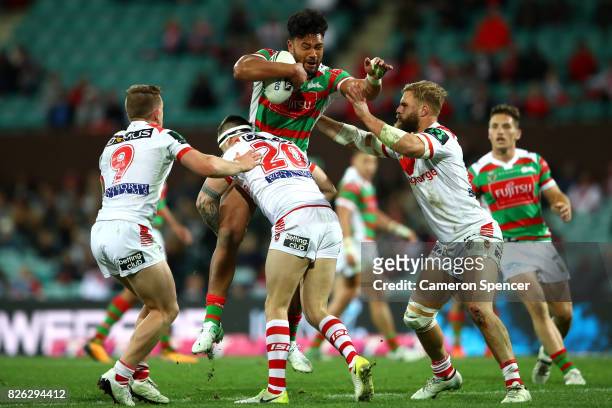 Zane Musgrove of the Rabbitohs is tackled during the round 22 NRL match between the St George Illawarra Dragons and the South Sydney Rabbitohs at...