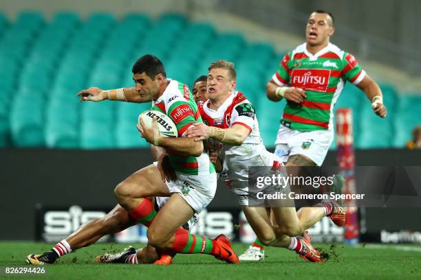 Bryson Goodwin of the Rabbitohs is tackled during the round 22 NRL match between the St George Illawarra Dragons and the South Sydney Rabbitohs at...