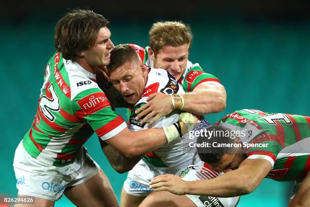 Tariq Sims of the Dragons is tacked during the round 22 NRL match between the St George Illawarra Dragons and the South Sydney Rabbitohs at Sydney...