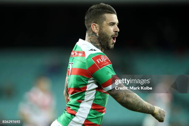 Adam Reynolds of the Rabbitohs celebrates kicking a goal late in the match during the round 22 NRL match between the St George Illawarra Dragons and...