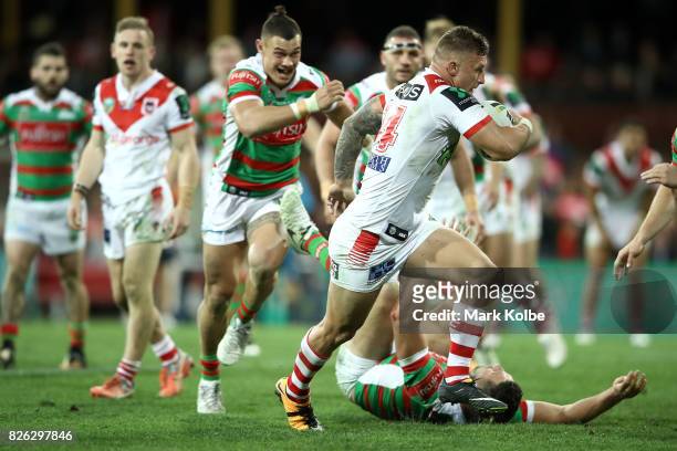 Tariq Sims of the Dragons makes a break during the round 22 NRL match between the St George Illawarra Dragons and the South Sydney Rabbitohs at...
