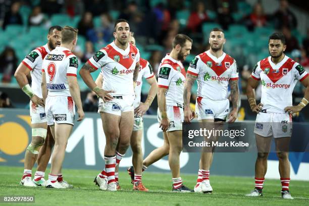 The Dragons look dejected after a a Rabbitohs try during the round 22 NRL match between the St George Illawarra Dragons and the South Sydney...