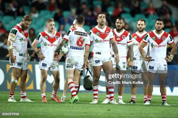 The Dragons look dejected after a a Rabbitohs try during the round 22 NRL match between the St George Illawarra Dragons and the South Sydney...