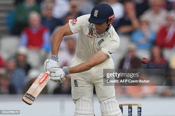 England's Alastair Cook plays a shot on the first day of the fourth test at Old Trafford Cricket Ground in Manchester, north-west England on August...