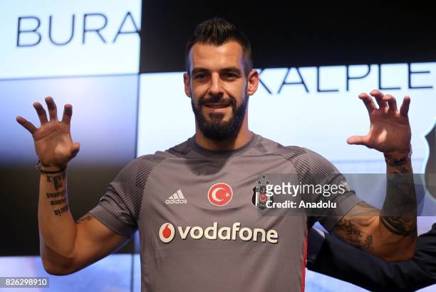 Besiktas' new transfer Alvaro Negredo Sanchez poses for a photo during a press conference after the signing ceremony at Vodafone Park in Istanbul,...