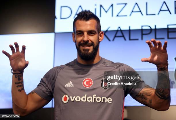 Besiktas' new transfer Alvaro Negredo Sanchez poses for a photo during a press conference after the signing ceremony at Vodafone Park in Istanbul,...