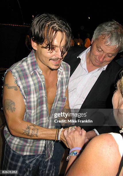 Johnny Depp greets fans after performing as part of the Sheila Witkin Memorial Reunion Concert at Club Cinema on August 29, 2008 in Pompano Beach,...