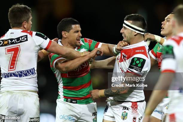 Cody Walker of the Rabbitohs and Jake Marketo of the Dragons scuffle during the round 22 NRL match between the St George Illawarra Dragons and the...
