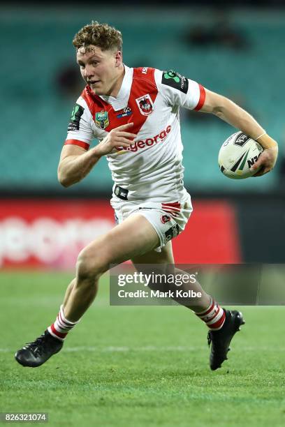 Kurt Mann of the Dragons runs the ball during the round 22 NRL match between the St George Illawarra Dragons and the South Sydney Rabbitohs at Sydney...