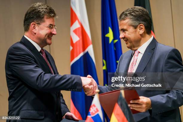 German Foreign Minister and Vice Chancellor Sigmar Gabriel and Miroslav Lajcak, Foreign Minister of Slovakia, sign a letter of understanding...