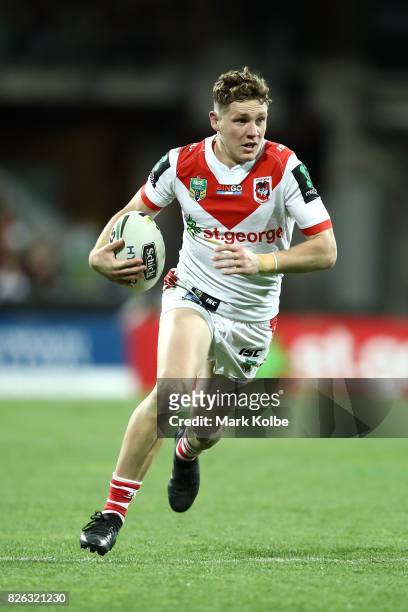 Kurt Mann of the Dragons runs the ball during the round 22 NRL match between the St George Illawarra Dragons and the South Sydney Rabbitohs at Sydney...
