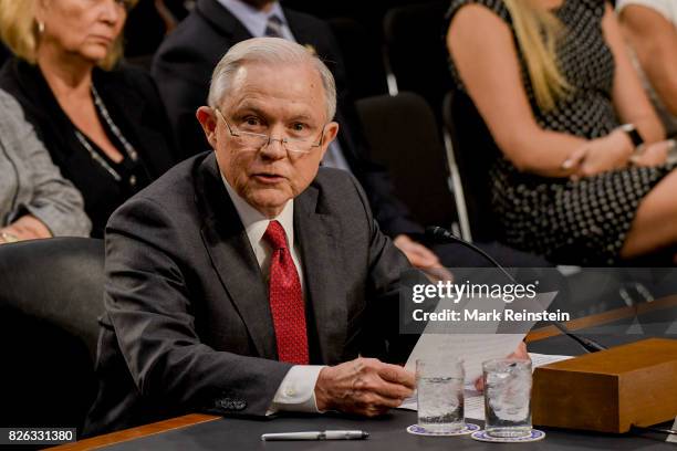 Attorney General Jeff Sessions reads an opening statement as he testifies before the Senate Intelligence Committee, Washington DC, June 13, 2017.