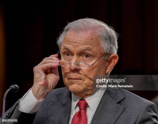 Attorney General Jeff Sessions adjusts his glasses as he testifies before the Senate Intelligence Committee, Washington DC, June 13, 2017.